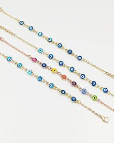 Evil Eye Bracelet is adjustable, it comfortably fits on any wrist. Evil eyes are believed to protect the person who carries them. Evil eye charms are also believed to bring good luck and deflect the negative energy. This Evil eye beaded bracelet can be a perfect gift. There are 7 Evil eye beads on this Turkish Eye Bracelet. For more evil eye bracelets, click the link below; https://www.etsy.com/shop/EyeDesignsbyGG?ref=search_shop_redirect&section_id=30219689 Metal Bracelets With Adjustable Chain, Metal Bracelets With Adjustable Chain And Round Beads, Adjustable Multicolor Chain Bracelet, Metal Beaded Bracelets With Adjustable Chain, Handmade Adjustable Multicolor Chain Bracelet, Adjustable Handmade Multicolor Chain Bracelet, Adjustable Multicolor Handmade Chain Bracelet, Multicolor Adjustable Bracelets, Adjustable Blue Round Bead Chain Bracelet