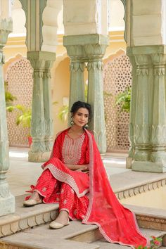 This Red Rayon Leheriya Embroidered Sharara Suit features a long kurta with Zari and Sequins embroidery accents on the yoke, sleeves, and hemline. The suit includes a coordinating sharara and a printed chiffon dupatta with an embroidered border for a unique, elegant look. Perfect for special occasions. Final Sale Color: Red Top: Rayon Bottom: Rayon Dupatta: Chiffon Top Length: 46" Bottom Length: 41" Dupatta Size: 2.2 m Occasion: Festive Print-Pattern: Leheriya Ornamentation: Zari Shape: Straight Phulkari Pants, Lucknowi Kurta, Gharara Suits, Patiala Salwar Suits, Embroidered Sharara, Bridal Dupatta, Phulkari Dupatta, Long Kurta, Plus Size Suits