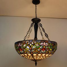 a stained glass chandelier hanging from the ceiling