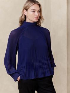 Pleated Volume-Sleeve Blouse | Banana Republic Factory Fitted Evening Tops With Pleated Sleeves, Chic Pleated Stretch Top, Fitted Pleated Tops For Work, Pleated Long Sleeve Tops For Daywear, Elegant Blue Blouse With Pleated Sleeves, Fitted Tops With Pleated Sleeves For Formal Occasions, Elegant High Neck Blouse For Work, Fitted Pleated Tops, Spring Evening Tops With Pleated Sleeves