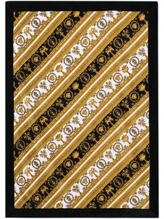 a black and yellow tie with an ornate design on the bottom, in front of a white background