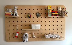 a peg board with some toys on it