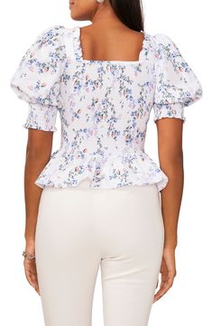 Comfortable, stretchy smocking perfects the slim fit of this flower-strewn cotton poplin top finished with a face-framing neckline and a softly ruffled peplum. Square neck Short sleeves 100% cotton Machine wash, line dry Imported Cotton Square Neck Blouse With Floral Print, Cotton Blouse With Floral Print And Square Neck, Spring Cotton Puff Sleeve Top With Square Neck, Spring Cotton Puff Sleeve Top With Smocked Back, Feminine Cotton Smocked Top For Spring, Feminine Cotton Smocked Top For Day Out, Cotton Smocked Top With Floral Print For Day Out, Spring Stretch Smocked Top With Ruched Detail, Fitted Floral Print Cotton Smocked Top