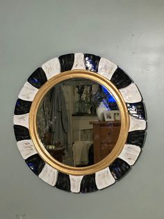 a mirror that is hanging on the wall