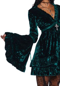 Be heavenly in this stretchy crushed velvet mini dress which has tiered bell sleeves, interlocking ribbon detailing, a ruffled trim, a plunging neckline, a cross charm on the front, and a tiered skirt. Velvet Ruffle Mini Dress, Emerald Velvet, Dress With Bell Sleeves, Velvet Mini Dress, Gothic Clothes, Future Style, Mini Velvet Dress, Goth Outfits, Bell Sleeve Dress