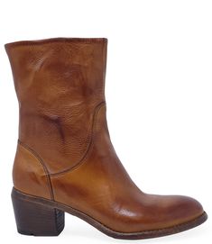 Our Handmade in Italy Leather Ankle Boot offers a perfect blend of style and craftsmanship, featuring a sleek almond toe, a 2-inch wooden block heel, and a convenient side zipper for easy wear. Made from 100% high-quality leather, this boot not only provides durability but also fits true to size for optimal comfort. With a 7-inch shaft height, this versatile boot is designed to be worn year-round, making it the ideal companion for any wardrobe. Pair it with jeans and a cozy sweater for a casual Classic Brown Block Heel Boots, Classic Brown Heeled Boots With Block Heel, Brown Low Heel Boots With Leather Sole, Classic Brown Boots With Block Heel, Classic Brown Low Heel Boots, Classic Brown Boots With Low Heel, Brown Low Heel Boots With Reinforced Heel, Cognac Boots With Stacked Heel And Medium Width, Cognac Boots With Stacked Heel And Almond Toe