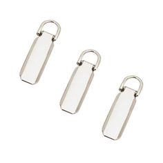 three metal clippings with one side open and the other half closed, on a white background