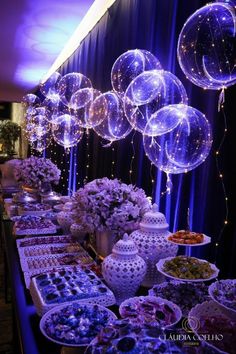 a buffet table with balloons and food on it