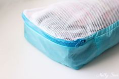 a blue and white bag sitting on top of a table