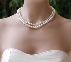 "Pearl Bridal Necklace in a double strand style is made with Swarovski Pearls and crystal accents for an elegant and modern 'classic' necklace. We used two different size pearls in this necklace and it looks sensational at a longer 'flapper' length. A crystal and rhodium extendable closure provides easy final adjustment. We used Ivory white pearls in the photos but you can customize from our extensive pearl selection to make it your own unique piece. Length- Inside strand 15\", 17\", 19\" & Affordable Adjustable Pearl Necklace For Wedding, Elegant Double Strand Necklace For Weddings, Double Pearl Necklace, Classic Double Strand Wedding Necklaces, Pearl Bridal Necklace For Wedding, Elegant Single Strand Bridal Necklace For Wedding, Elegant White Bridal Necklace For Bridal Shower, Double Strand Pearl Necklace For Wedding, White Double Strand Pearl Necklace For Wedding