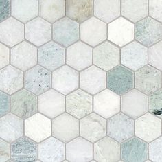 a white and grey hexagonal tile pattern with different colors on the tiles,