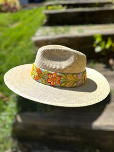 Our Mexican, high quality Artisal Palm Hat, comes with a removable hand embroidered band.  The band is embroidered by Female Artisans of the Andes in Perú.  This classic wide brim hat has sturdy weave to be used in the beach and all adventures in the sun.  Great sun protection.  The close-weave material in this product offers UPF 50+ which blocks 97.50% of the sun's UV rays. One size Traditional Woven Straw Hat For Spring, Summer Brimmed Hats With Embroidery, Summer Embroidered Short Brim Hat, Embroidered Summer Hat With Short Brim, Festival Woven Fedora With Flat Brim, Festival Fedora With Woven Flat Brim, Festival Fedora With Woven Detail And Flat Brim, Embroidered Wide Brim Summer Hat, Summer Wide Brim Embroidered Hats