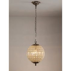 a chandelier hanging from the ceiling in a room