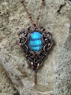 Made with faceted teardrop labradorite gemstone with bright blue shine. The stone has a hole in it so it's securely attached. The color of the shine is rich blue like late evening sky with some clouds on it. If you move the pendant, the fire inside the stone moves similar to light in a holographic picture. Flat solid copper wire for the pendant I made myself. It also required some soldering.  Chain is also solid copper with adjustable length (18 - 20 inches), I can make it even longer or shorter Bohemian Wire Wrapped Teardrop Pendant Jewelry, Unique Wire Wrapped Teardrop Pendant Jewelry, Artisan Bronze Teardrop Jewelry, Wire Wrapped Labradorite Teardrop Pendant Necklace, Hand Forged Teardrop Nature-inspired Jewelry, Wire Wrapped Labradorite Teardrop Jewelry, Handmade Copper Wire Teardrop Pendant Jewelry, Teardrop Healing Jewelry Wire Wrapped, Teardrop Copper Wire Jewelry For Gifts