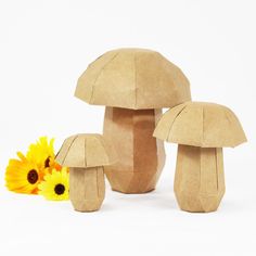 an image of three mushrooms with flowers in the middle and one on the other side