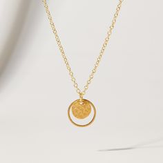 "Double Circle and Hammered Gold Disc Pendant Necklace from OhSoFitting ⭐   Want to get 20% off your first order? Join the Style Club and get a coupon for 20% off sent to your inbox! https://bit.ly/ohsoetsycoupon.⭐ The type of chic necklace never goes out of style! This 16K gold plated double circle pendant comes on a dainty gold chain and looks elegant on its own, or layered with other gold chains, pearls or beads - giving you so many styling options, every season of the year! NECKLACE DETAILS ⚬ 16K gold plated hammered disc pendant with a matte finish inside a matte gold plated circle. ⚬ Pendant is 5/8\". ⚬ 16\" 18K gold plated chain, nickel-free and hypoallergenic. QUESTIONS? Just use the \"Message Merrie\" button below and I'll be happy to help! Thanks for shopping at OhSoFitting!" Minimalist Metal Jewelry With Coin Pendant, Sterling Silver Circle Necklaces Tarnish Resistant, Tarnish Resistant Sterling Silver Circle Necklaces, Nickel Free Yellow Gold Pendant Necklace, Nickel-free Yellow Gold Pendant Necklace, Elegant Gold Coin Necklace Nickel Free, Nickel-free Yellow Gold Metal Necklace, Brass Circle Necklace For Gifts, Metal Necklace With Round Pendant For Anniversary