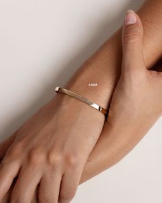 14k solid gold Width: 4 mm, 5 mm, and 6 mm Oval, hinged bangle Push clasp with safety latch Luxury Stackable Rose Gold Bangle, Sleek Polished Bangle Jewelry, Luxury Rose Gold Stackable Bangle, Sleek Polished Bangle Bracelet, Everyday Luxury 14k Rose Gold Bracelets, Modern Stackable Rose Gold Jewelry, Modern Rose Gold Stackable Jewelry, Adjustable 14k Gold Timeless Bangle, Adjustable Rose Gold Bangle With Polished Finish