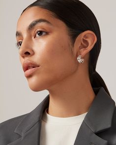 Chunky hoop earrings with an understated profile and custom JB ball backings. Finished in high-polish silver. silver dipped brassfinish: high polishball backing product measurements:length: 17.9mm / 0.71"width: 8.6mm / 0.34"depth: 18.2mm / 0.72"ball backing: 6mm / 0.24"weight: 4.24g / 0.15ozstyle: JB3409-HPSimported Modern Huggie Wrap Earrings, Modern Sphere Earrings, Trendy Sterling Silver Hoop Earrings For Formal Occasions, Chic Silver Single Wrap Earring, Chic Polished Silver Hoop Earrings, Chic Silver Hoop Earrings With Polished Finish, Chic Silver Jewelry For Workwear, Chic Silver Jewelry For Work, Silver Metal Huggie Earrings For Formal Occasions