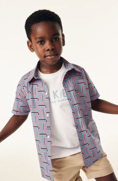 Ted Baker style starts young with a crisp cotton button-up your child will want to layer over the coordinating logo T-shirt. Shirt has front button closure; chest patch pocket Shirt is 98% cotton, 2% spandex; T-shirt is 100% cotton Machine wash, tumble dry Imported Cotton Crew Neck Shirt With Button Closure, Cotton T-shirt With Button Closure For Spring, Spring Cotton T-shirt With Button Closure, Blue Crew Neck Shirt With Button Closure, Playful Summer Tops With Button Closure, Playful Tops With Button Closure For Spring, Blue T-shirt With Button Closure And Crew Neck, Blue Short Sleeve T-shirt With Buttons, Blue Short Sleeve Tops With Snap Buttons