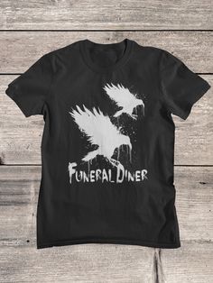 Funeral Diner T-Shirt. Funeral Diner was a screamo band from Half Moon Bay, California, located near San Francisco. Our Shirts, hoodies and tanks have been carefully chosen after many years of testing, they are semi fitted around the chest and arms, and therefore give a complimentary look, but they also come in a nice length, Our shirts can be washed many times and the print will not fade, so you can enjoy your product for many years to come.  Your Order will be shipped from the country closest Halloween Band Merch T-shirt With Graphic Design, Horror Graphic Print Tops For Fan Merchandise, Grunge Shirt With Band Logo For Fans, Halloween Band Logo T-shirt For Fans, Halloween Band Logo T-shirt Crew Neck, Halloween Band Merch Tops With Band Logo, Halloween Band Merch Top With Band Logo, Band Merch Tops With Band Logo For Halloween, Band Logo Merch Tops For Halloween