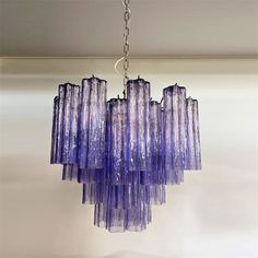 a purple chandelier hanging from a ceiling