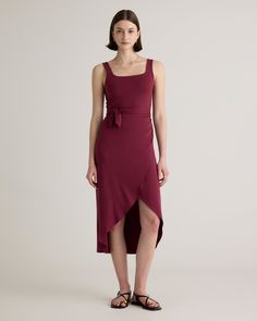 Upgrade your wardrobe with the Tencel Jersey Side Tie Dress, a luxurious and versatile piece that will make you feel confident and elegant for any occasion. Made from premium Tencel fabric, this dress offers a silky smooth texture that drapes beautifully over your curves. Simply pair it with your favorite sandals or heels and accessories for a complete look that's both comfortable and chic.  | Quince | Women's Tencel Jersey Side Tie Midi Dress in Wine, Size Small Side Tie Dress, Tencel Fabric, Tie Dress, Smooth Texture, Quince, Feel Confident, Make You Feel, Jumpsuit Dress, Midi Dress