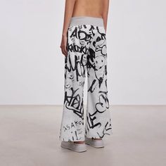 Embrace the perfect fusion of playful charm and street style with our Doodle Full-Print Wide-Leg Pants. These pants are adorned with vibrant cartoon doodles printed all over, creating a unique and eye-catching look. The waistband features a knitted ribbed design with an adjustable drawstring for a comfortable and customizable fit. Designed with a low-rise waist, these pants offer a relaxed, oversized fit, ensuring both comfort and style. Crafted from premium fabric, they are durable and perfect Cartoon Doodles, Printed Wide Leg Pants, Graffiti Prints, Brand Sale, Print Fabric, Sale Design, Stylish Design, Oversized Fits, Leg Pants