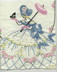 a piece of cloth with an image of a woman holding an umbrella