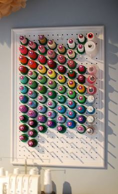 there is a wall hanging with buttons on it