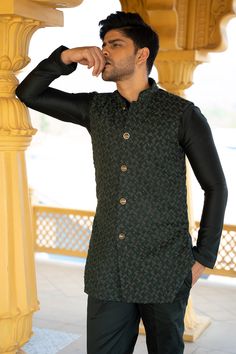 Emerald green handwork bundi with detailed cutdana and French knot embroidery. Paired with a monotone kurta and pant.
Components: 3
Pattern: Embroidered
Type Of Work: French Knot,Cutdana
Neckline: Band
Sleeve Type: Full
Fabric: Suiting,Chanderi silk
Color: Green
Other Details: 
Front buttons
Hand work
Occasion: Wedding - Aza Fashions Green Nehru Jacket With Resham Embroidery For Transitional Season, Designer Green Kurta For Festive Occasions, Designer Nehru Jacket With Intricate Embroidery For Festive Occasions, Designer Nehru Jacket With Cutdana In Traditional Drape, Designer Nehru Jacket With Zari Work For Festive, Designer Festive Nehru Jacket With Zari Work, Festive Green Nehru Jacket With Intricate Embroidery, Designer Nehru Jacket With Cutdana For Festive Occasions, Festive Designer Nehru Jacket With Cutdana