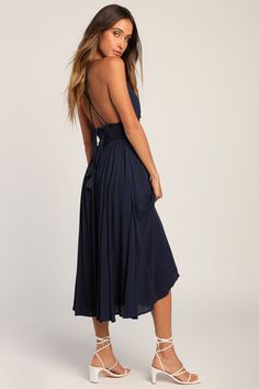 Whether you're headed to a summer soiree or just out for the day, the Lulus Essentially Elegant Navy Blue Sleeveless Backless Midi Dress will have you looking your best! Lightweight woven fabric shapes this flattering, go-everywhere dress. Tying spaghetti straps (with tasseled aglets) cross the open back, supporting a smocked bodice with a plunging V-neckline. Banded empire waist tops the draping skirt that has godet details and falls to a midi hem. Fit: This garment fits true to size. Length: M Chic Strapless Backless Beach Dress, Chic Backless Maxi Dress For Summer, Summer V-neck Dress With Knotted Straps, Chic Strapless Backless Dress For Vacation, Chic Backless Summer Midi Dress, Chic Summer Backless Midi Dress, Elegant Sleeveless Beach Dress For Brunch, Strapless Backless Dress For Summer, Chic Sleeveless Backless Dress For Beach Season