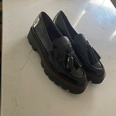 Sarto Loafers. Never Worn. Size 8. Runs About A Half Size Small Casual Black Slip-on Tassel Loafers, Black Slip-on Tassel Loafers With Textured Sole, Black Tassel Loafers With Textured Sole For Work, Black Round Toe Tassel Loafers For Office, Black Tassel Loafers With Round Toe, Black Tassel Loafers With Flat Heel For Work, Black Slip-on Tassel Loafers With Round Toe, Black Closed Toe Tassel Loafers For Work, Black Tassel Loafers For Workwear With Closed Toe