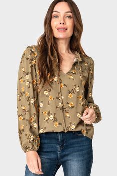 Complete your look with a classic blouse; featuring a smocked yoke, ruffle details, blouson sleeves, and a tie front. 100% Rayon Delicate Wash Cycle, Dry Flat. Length 26" (size small) Jing is 5'8 and wearing size XXS in IvoryNattalie is 5'9 and wearing XXS in Olive Fall Floral Fall Puff Sleeve Peasant Top With Relaxed Fit, Fall Peasant Top With Puff Sleeves And Relaxed Fit, Casual Floral Print Peasant Top With Balloon Sleeves, Fall Relaxed Fit Peasant Top With Puff Sleeves, Balloon Sleeve Blouse With Smocked Cuffs For Brunch, Billowy Peasant Top With Blouson Sleeves For Fall, Fall Flowy Peasant Top With Puff Sleeves, Casual Peasant Top With Floral Print And Lantern Sleeves, Flowy Peasant Top With Puff Sleeves For Fall