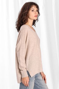 The relaxed, boyfriend fit and classic V-neck design make this a versatile wardrobe staple that can be dressed up or down with ease. Whether you're lounging at home or enjoying a casual outing, this cashmere tee provides a blissful wearing experience. Fabric Content: 100% Cashmere SIZE GUIDE (Inches) XS/S M/L LENGTH 26 26 1/2 ACROSS CHEST 28 30 SLEEVE LENGTH 30 1/2 31 ACROSS BACK 28 30 Chic Relaxed Fit V-neck Top For Fall, Oversized Casual V-neck Sweater For Loungewear, Trendy Relaxed Fit V-neck Sweater, Trendy Oversized V-neck Sweater For Loungewear, Casual Cashmere V-neck Sweater For Layering, Classic Oversized V-neck Top, Casual Cashmere V-neck Sweater, Cozy Fine Knit V-neck Tops, Fine Knit V-neck Top With Relaxed Fit