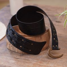 Bright iron accents over elegant black leather make a gorgeous and handy accessory. Designed by Balinese artisan Tomomi, this leather belt features an iron hook buckle for a secure and easy fit, with an adjustable length that will allow you to feel its comfortable and high-quality design. Armor Clothing, Belt Hook, Iron Accents, Iron Hook, Leather Wristbands, Leather Cuffs Bracelet, Black Leather Belt, Leather Cleaning, Women Artisans