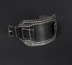 -Bund strap of High quality. Compatible with watch case 18mm 20mm 22mm 24mm. Black leather watch band with a vintage effect and a slight shine is unique, no two straps are the same. -Stitched leather cuff watch strap is soft, comfortable, durable and fits perfectly on the wrist, enhances the beauty of your watch.  Made of best english distressed leather. Will appeal to connoisseurs of vintage style. Swap bands to suit an occasion or to give your watch a new look. Handmade wrist strap vintage style is a really nice and thoughtful gift for a special someone that will remind them of you for a long time. -Military aviator strap Design. Designed and made by me from start to finish. I wanted the strap to be durable and comfortable so I chose distressed leather Crazy Cow. Leather from the legenda Black Leather Watch, Leather Watch Band, Cuff Watch, Leather Watch Bands, Stitching Leather, Leather Cuffs, Distressed Leather, Handcrafted Leather, Watch Case