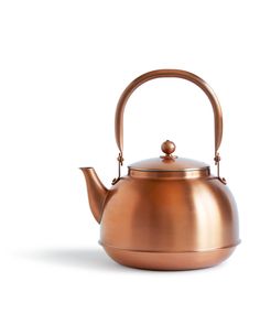 a copper tea kettle with a handle on a white background