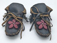 Men's or women's genuine buffalo leather moccasins with a securely sewn hand-beaded floral design.  These moccasins were authentically and beautifully handmade (all hand stitching) by Anishinaabe/ Ojibwe tribal artisans, Amy Clark, Heather Romero and Angel Roy of Pine Point Village, which is located within the White Earth Nation Reservation in Northern Minnesota.  The moccasins are 9 1/2 inches long and 4 inches wide.  Size 8/9 women's.  Size 7/8 men's. Indian Moccasins, Beaded Buffalo, Earth Nation, Pine Point, Native American Moccasins, Beaded Moccasins, Beaded Shoes, Northern Minnesota, Leather Moccasins