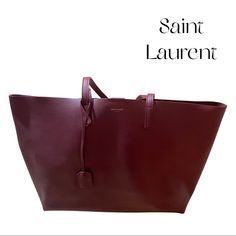 Saint Laurent Leather Tote Bag 100% Leather Burgundy Fall Collection Color Press Stud Closure Top Handles, Spacious Interior, Gold-Toned Lettering Width 37cm, Height 28cm, Depth 13cm Specialist Leather Clean Made In Italy Used A Couple Of Times, Excellent Condition, Includes Zippered Pouch Inside Business Burgundy Bags With Palladium Hardware, Designer Burgundy Shopping Bag, Designer Burgundy Shoulder Bag For Shopping, Designer Burgundy Bag For Shopping, Designer Burgundy Bag For Everyday, Luxury Burgundy Tote Bag, Classic Burgundy Bag With Dust Bag, Classic Burgundy Bag With Dust Bag Included, Designer Burgundy Tote Bag