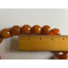 Large natural Baltic Amber worry beads strung on a fabric cord. Each round bead measures under 1" diameter. Strand includes 19 large beads and 3 small beads. Must be restrung on a longer cord if you wish to wear these beads as a necklace. Originally used as worry beads in the hand. Wonderful color and natural inclusions. Adjustable Amber Beaded Necklace With Large Beads, Spiritual Amber Round Beads, Orange Large Beads, Adjustable Polished Amber Beads, Adjustable Round Beaded Necklaces Hand-strung, Adjustable Hand-strung Beaded Necklaces, Adjustable Round Beaded Necklaces, Amber Spiritual Round Beads, Vintage 8mm Adjustable Beads