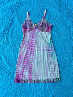 Expertly hand dyed nylon vintage slip dress. Layer this look over a turtle neck in the winter or over a swimsuit by the pool, they're great on their own too! This vintage slip has been carefully tie dyed to disguise stains and discoloration. Originally white, it has a unique all over shibori pattern in teal and pink. Can be washed on cold with like colors. This is a one of one item This slip is in very good vintage condition. There are no holes or tears. The straps are adjustable. Bust:36" Waist Bohemian Fitted Dresses For Poolside, Fitted Bohemian Dress For Poolside, Bohemian Fitted Dress For Loungewear, Fitted Bohemian Dresses For Loungewear, Hand Dyed Fitted Summer Dress, Slip Dress Lingerie, Pink Slip Dress, Shibori Pattern, Vintage Slip Dress