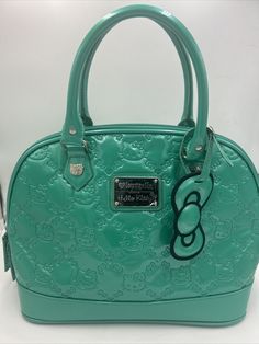 Stunning New (no tags, but plastic still on front plate) Loungefly loves Hello Kitty Sanrio shiny green Patent Embossed Dome Tote Satchel Handbag Y2K. Measures approximately : 14 x 12 x 7 inch These purses are no longer made. Includes bow hang tag. Stored in a smoke free environment. Thanks for looking and feel free to contact us with any questions. Sanrio Green, Loungefly Hello Kitty, Hello Kitty Purse, Front Plate, Hello Kitty Sanrio, Satchel Handbags, Hang Tags, Purses And Handbags, Bags Handbags