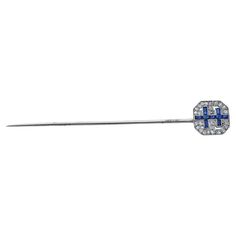 On of a Kind Stick Pin from the Early 20th century. The piece was crafted in 18k white gold featuring approximately 2.75 inches of pin for proper securing. The pave face of the pin features diamonds and sapphires in a double cross pattern. The face of the pin measures approximately 0.5 inches. A great piece for any lapel - men or women. La Face, Cross Patterns, Stick Pins, Early 20th Century, Black Diamond, French Antiques, 20th Century, The Face, Sapphire