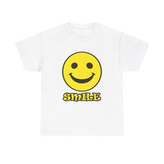 Colors: White, Black, Gold (Yellow), Orange, Forest Green (Dark Green), Irish Green (Light Green), Light Blue, Royal (Blue), Purple, Red A comfortable Tee featuring a smiling Smiley and the text 'Smile', radiating positivity and joy. Perfect for casual outings or lounging at home, this Tee is ideal for those who love spreading happiness. Relevant for birthdays, holidays, and everyday wear. Product features - Shoulder tape for stability - Ribbed knit collar for elasticity - Made from strong and s Happy Emoticon, Radiating Positivity, Orange Forest, Smiley Face Shirt, Green Dark, Green Light, Knit Collar, Smiley Face, Yellow Orange