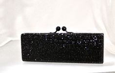 "Heart- stoppingly beautiful! These Rectangular Formal Evening Purses in Stunning Colors will be the talk of town!! Each takes a month to make, crystal by crystal, all done by hand! Each one is a brand new evening bag fully covered in genuine, very fine, small sized Swarovski Crystals from Austria! This exquisite minaudiere bag is fully crystallized in all sides with meticulous precision and spectacular detail. It is also lined in genuine leather. You can carry it in the palm of your hand as a c Elegant Clutch With Bling For Events, Elegant Sparkling Clutch Evening Bag, Elegant Event Clutch With Bling, Chic Crystal Evening Bag For Weddings, Elegant Bling Clutch For Events, Rectangular Sparkling Evening Clutch, Elegant Evening Bag With Crystal Bling, Sparkling Clutch Evening Bag For Formal Occasions, Elegant Crystal Evening Bag With Bling