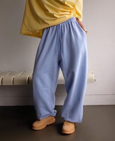 Wide leg. One Size. Side slant pockets Elastic waist. Elastic ankle  20% Polyester 80% Cotton Product Measurements: Waist 75cm / 29.5in Rise 40cm / 15.8in Length 104cm/40.9in Cotton Wide Leg Joggers, Baggy Cotton Sweatpants, Relaxed Style, Relaxed Baggy Sweatpants With Elastic Waistband, Baggy Leisure Sweatpants With Pockets, Baggy Cotton Athleisure Pants, Baggy Straight Sweatpants For Leisure, Baggy Sweatpants With Pockets For Leisure, Sporty Cotton Harem Pants For Loungewear, Sporty Cotton Harem Pants With Tapered Leg