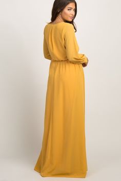 A maternity baby shower dress for stylish moms-to-be! A sold hued, chiffon maternity maxi dress featuring long, cuffed sleeves with buttons, a cinched elastic waist, pleated details, a waist tie and a v-neckline. Double lined to prevent sheerness. The Yellow Chiffon Long Sleeve Pleated Maternity Maxi Dress is perfectly bump-friendly! Spring Maternity Maxi Dress Floor-length, Spring Maternity Floor-length Maxi Dress, Modest Maxi Dress With Elastic Waistband, Maternity Maxi Dress In Solid Color, Modest Flowy Floor-length Maxi Dress, Flowy Solid Color Chiffon Maxi Dress, Flowy Modest Floor-length Maxi Dress, Maxi Length Dress With Elastic Waistband, Solid Color Maxi Dress With Elastic Waistband