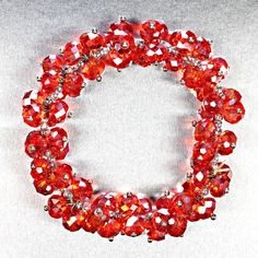 This is part of Chairish’s Costume Jewelry assortment.  Perfect Red Holiday bracelet!  This stretchy red AB crystal bracelet is just perfect for the holiday season or whenever you are in a holiday mood. This bracelet is loose on a 6.5-inch wrist and expands to at least 8 inches to over your hand. Red Crystal Bracelet For Party, Adjustable Red Crystal Bracelet, Adjustable Red Crystal Bracelets, Party Stretch Bracelet With Faceted Beads, Red Beaded Crystal Bracelet For Party, Red Crystal Bracelet Gift, Red Crystal Bracelet For Gift, Red Beaded Stretch Bracelet For Christmas, Red Crystal Beaded Bracelets