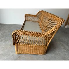 a wicker baby crib sitting on the floor