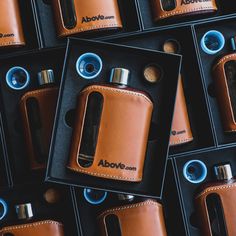 several different types of lighters in leather cases next to each other, one is brown and the other is blue